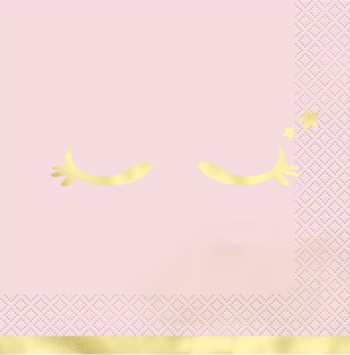 Pink napkin with gold decorative elements on a pink background
